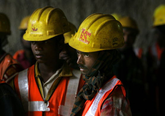 Gallery 21 January 2009: Delhi Metro Rail Corporation workers watch a tunnel boring machine