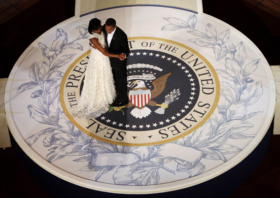 Gallery Eyewitness: Barack and Michelle Obama dance on a replica of the presidential seal