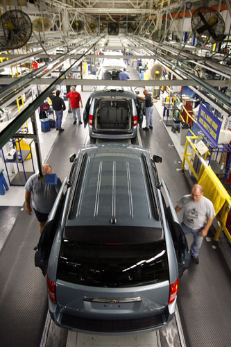 Gallery Business week: Employees work on the newest minivan version on the Chrysler assembly line