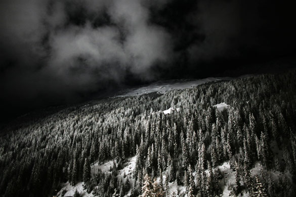 Gallery 24 hours : Clouds drift over a mountain above a village in Italy