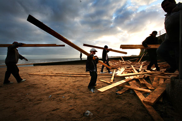 Gallery planks in Ramsgate: Locals collecting planks that were washed up on Ramsgate beach