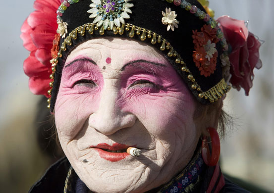 Gallery 24 hours in pictures: A performer  during a show to celebrate the Chinese Lunar New Year  