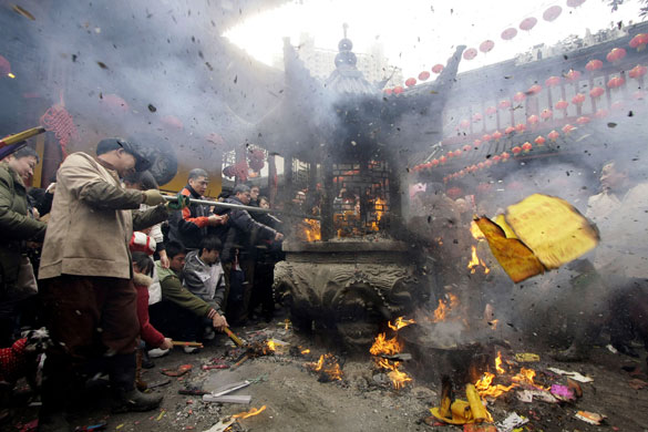 Gallery World Chinese New Year: burning joss sticks