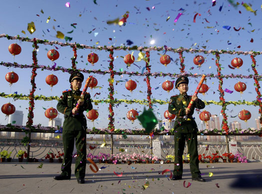 Gallery World Chinese New Year: Paramilitary policemen hold confetti