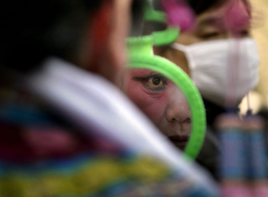 Gallery 27 January 2009: Beijing, China: A performer before a show