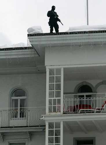 Gallery Davos: An armed Swiss police officer patrols at the World Economic Forum