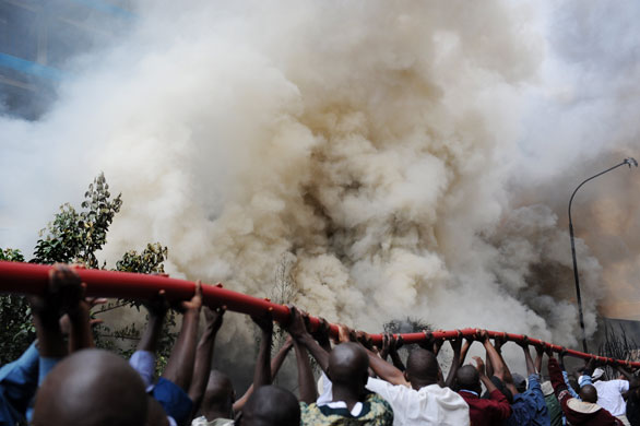 Gallery 29 January 2009: Nairobi, Kenya: Firefighters try to control a raging fire