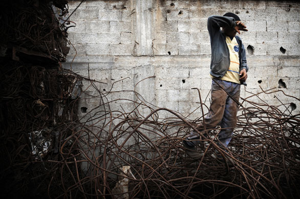 Gallery 29 January 2009: Gaza Strip: A boy sorts pieces of scrap metal