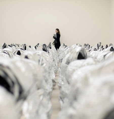 Gallery 30 January 2009: A woman looks at an artwork entitled 'Ghost 2007' by Kader Attia