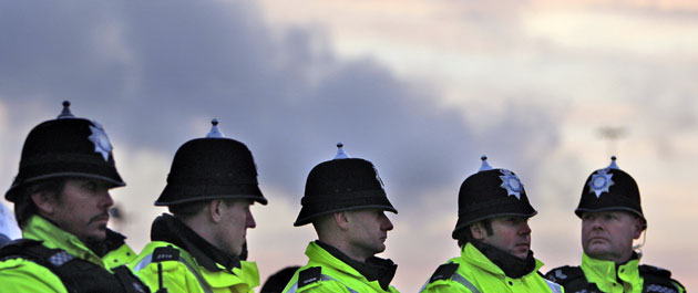 Gallery 30 January 2009: Immingham, UK: Police wait as crowds gather at the Lindsey oil refinery
