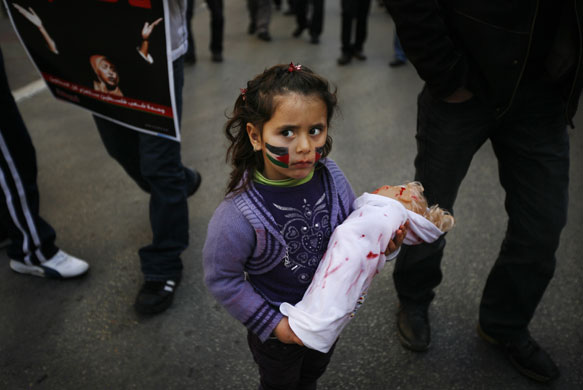 Gallery Israeli troops enter Gaza: An Israeli Arab girl  protests against Israel's military operations in Gaza
