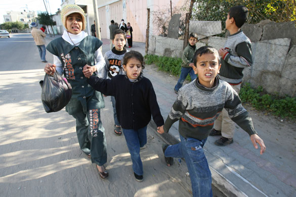 Gallery Israeli troops enter Gaza: Palestinians flee the Jabalia refugee camp in the northern Gaza Strip