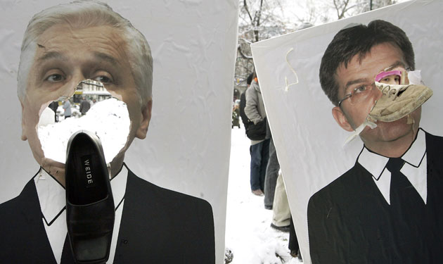 Gallery 24 hours in pictures: Activists pelt posters of politicians with shoes