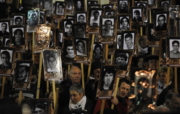Gallery 24 hours in pictures: Pro-independence supporters hold portraits of imprisoned members of ETA 