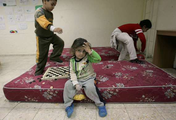 Gallery gaza conflict: Children play inside a bomb shelter in the  Israeli town of Sderot 