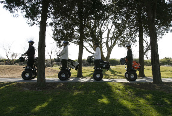 Gallery 24 hours in pictures: Men ride Segways during their round of golf 