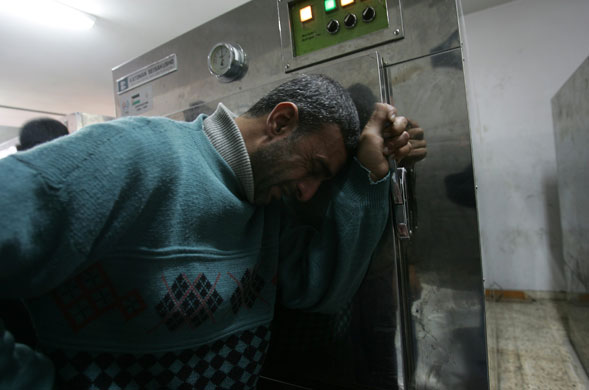 Gallery Gaza: A relative of a Palestinian victim cries at the morgue