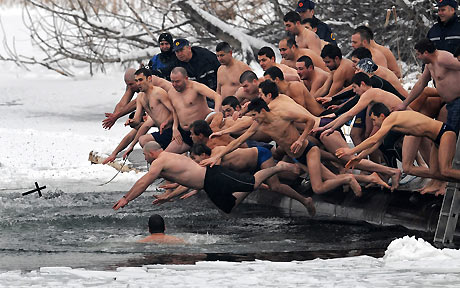 Bulgarians jump into a lake in Sofia to mark the Feat of the Epiphany