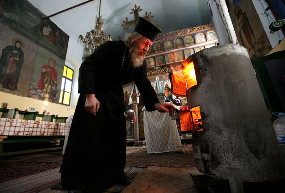 Gallery Russia Ukraine gas row: Bulgarian orthodox priest fires a wood burning stove 