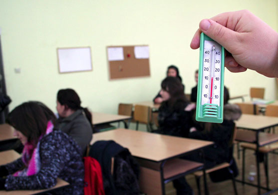 Gallery Russia Ukraine gas row: Bulgarian teacher holds a thermometer during a class