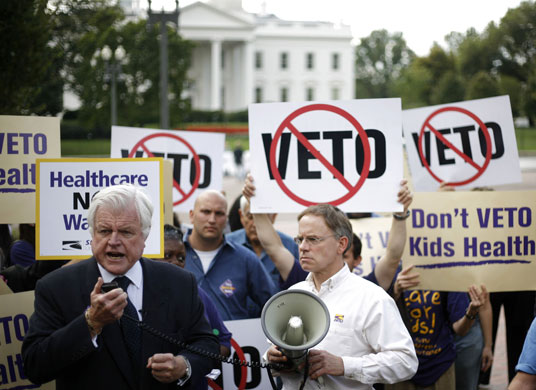 Gallery President George W Bush: U.S. Senator Edward Kennedy takes part in a protest