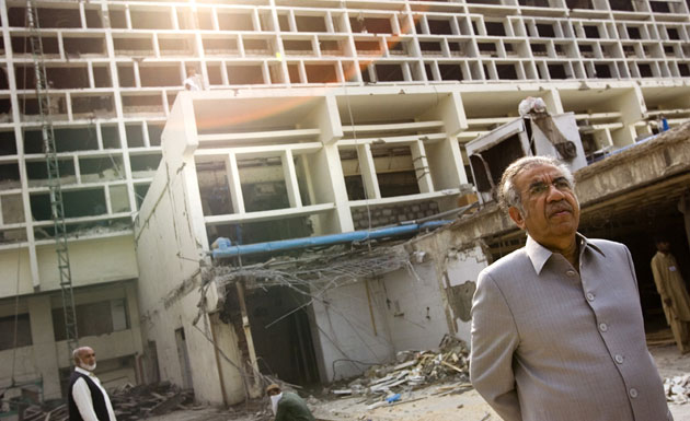 Gallery Labourers in Islamabad: The wreckage of the Marriott Hotel in Islamabad, Pakistan