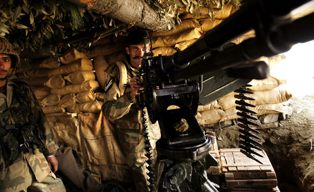 Gallery Soldier standing guard: Pakistani soldiers manning a foxhole