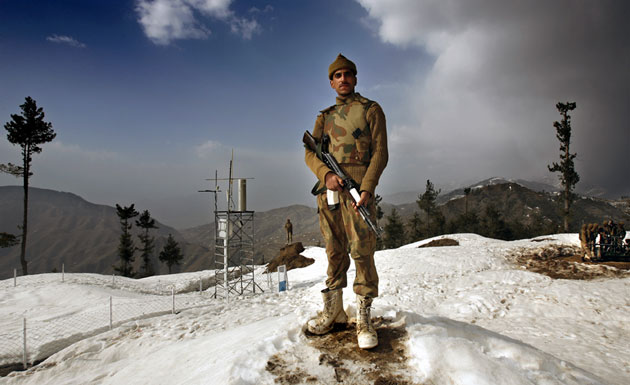 Gallery Soldier standing guard: A Pakistani soldier stands guard at a military outpost