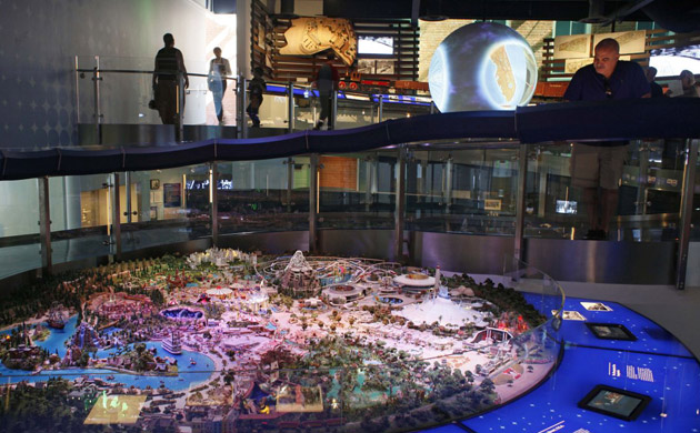 Visitors look at an exhibit at Walt Disney Family Museum in San Francisco. Items on display at the museum include a model of how Disney imagined what Disneyland would look like