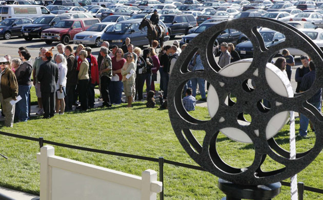 Visitors line up to enter the Walt Disney Family Museum. Disney's daughter, Diane Disney Miller, greeted the first visitors as she cut a ribbon to formally open the museum