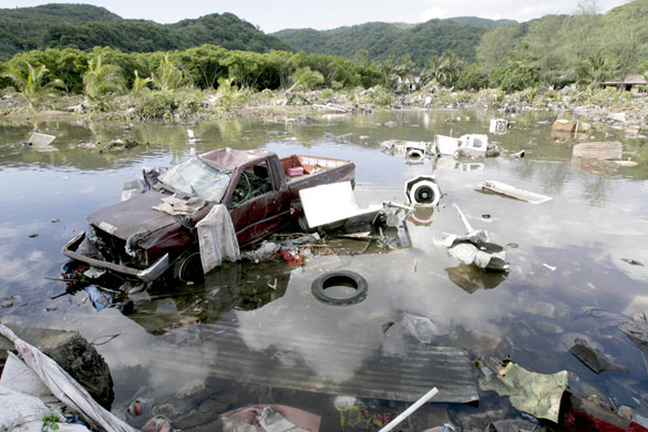 Samoa: A destroyed truck along with other debris in a lagoon