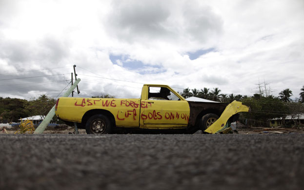 Samoa: Fresh graffiti adorns a tsunami-damaged vehicle
