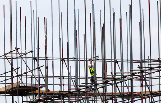 Week in Business: A scaffolder at work on a building site. 