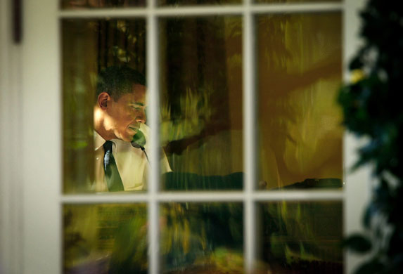 24 Hours in Pictures: President Barack Obama talks on the phone after winning Nobel Peace Prize 