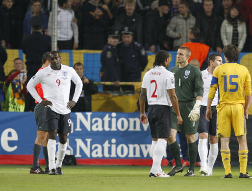 Ukraine v England: England players look dejected after Robert Green is shown the red card