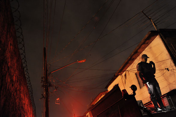 Sao Paulo Brazil fire: An officer receives information from firefighters as they fight the fire 