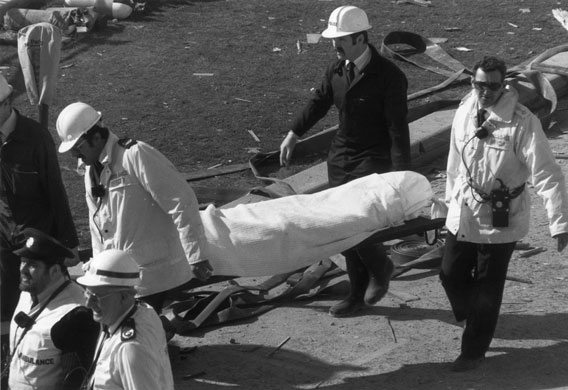 Brighton bombing 1984: Rescue workers carry a bomb victim on a stretcher 