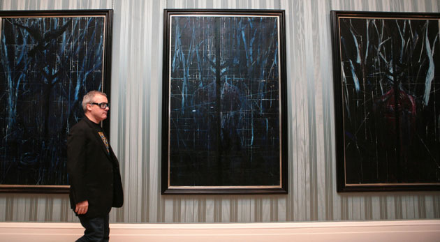 Damien Hirst No Love Lost: Artist Damien Hirst walks past part of his No Love Lost Blue Paintings