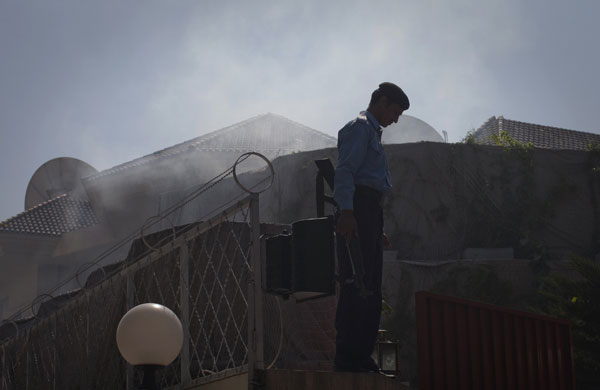 Pakistan: 5 October 2009: A policeman at the UN World Food Programme offices
