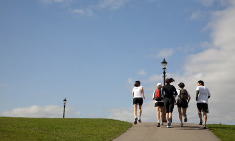 A group of runners on a jogging tour of London at Primrose Hill.