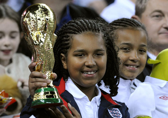 England v Belarus: A young fan holds a replica of the World Cup trophy