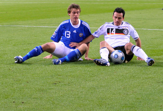 world cup qualifiers: Finland's Lampi and Germany's  Trochowski compete for ball 