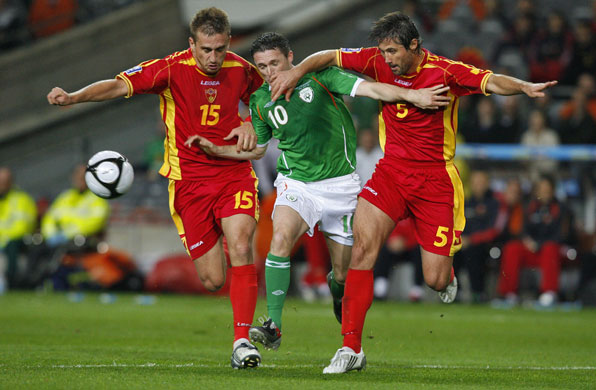 world cup qualifiers: Milorad Pekovic, left, & Radoslav Batak, right, block Robbie Keane