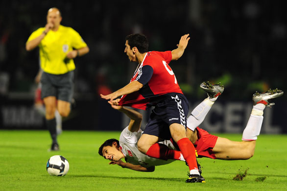 world cup qualifiers: Turkey's Ceyhun Gulselam is fouled by Armenia's Henrikh Mkhirtayan