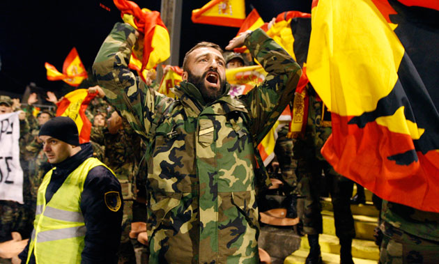 world cup qualifiers: A group of Spanish soldiers, shout in support of their team