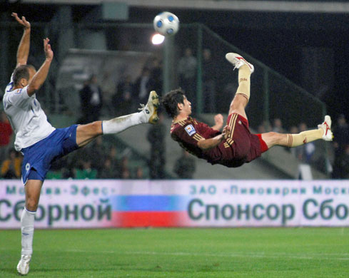 world cup qualifiers: Russia's Alan Dzagoyev tries to block Samir Abasov's overheat kick 