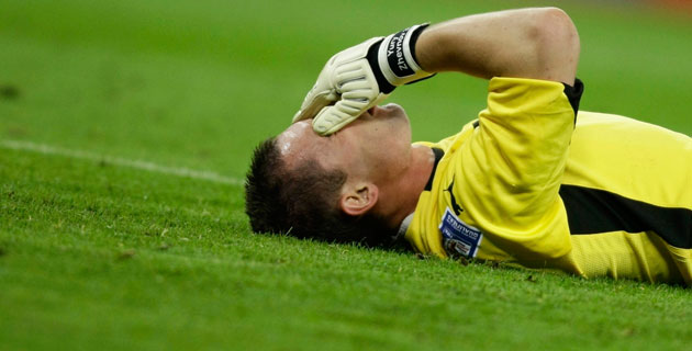 England v Belarus : Belarus' goalkeeper Yury Zhevnov reacts after a challenge 