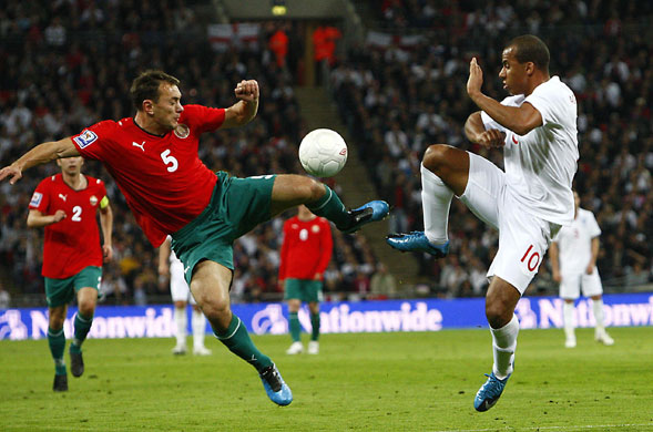 England v Belarus : Alexander Yurevich and Gabriel Agbonlahor battle for the ball 