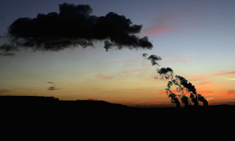 Rising steam from th Ratcliffe-on-Soar power station is silhouetted against the setting sun