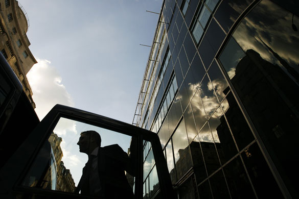 Week in Business: A man leaves a taxi outside the Goldman Sachs offices in London